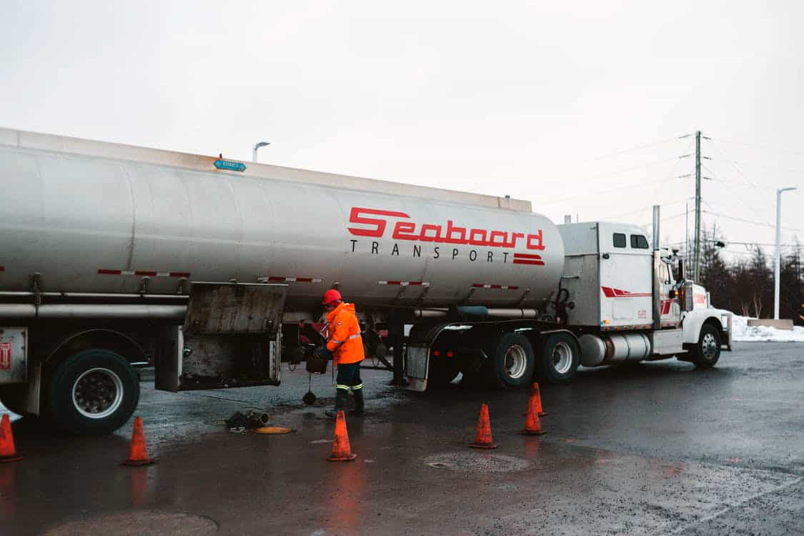 https://www.pexels.com/photo/unrecognizable-workman-cleaning-compartment-of-cargo-tank-on-city-road-4062506/